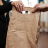 custom kraft paper bag with die cut handle and logo print view 2