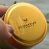 Embossed metal sticker with adhesive backing